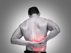 Young man suffering from back pain